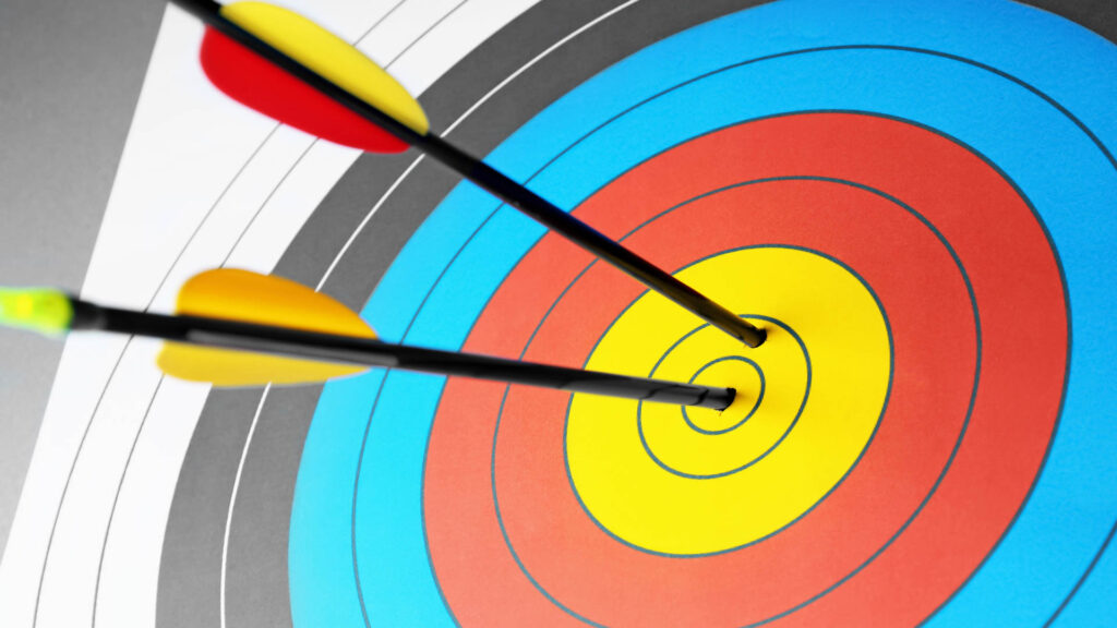 Arrows piercing target in the middle