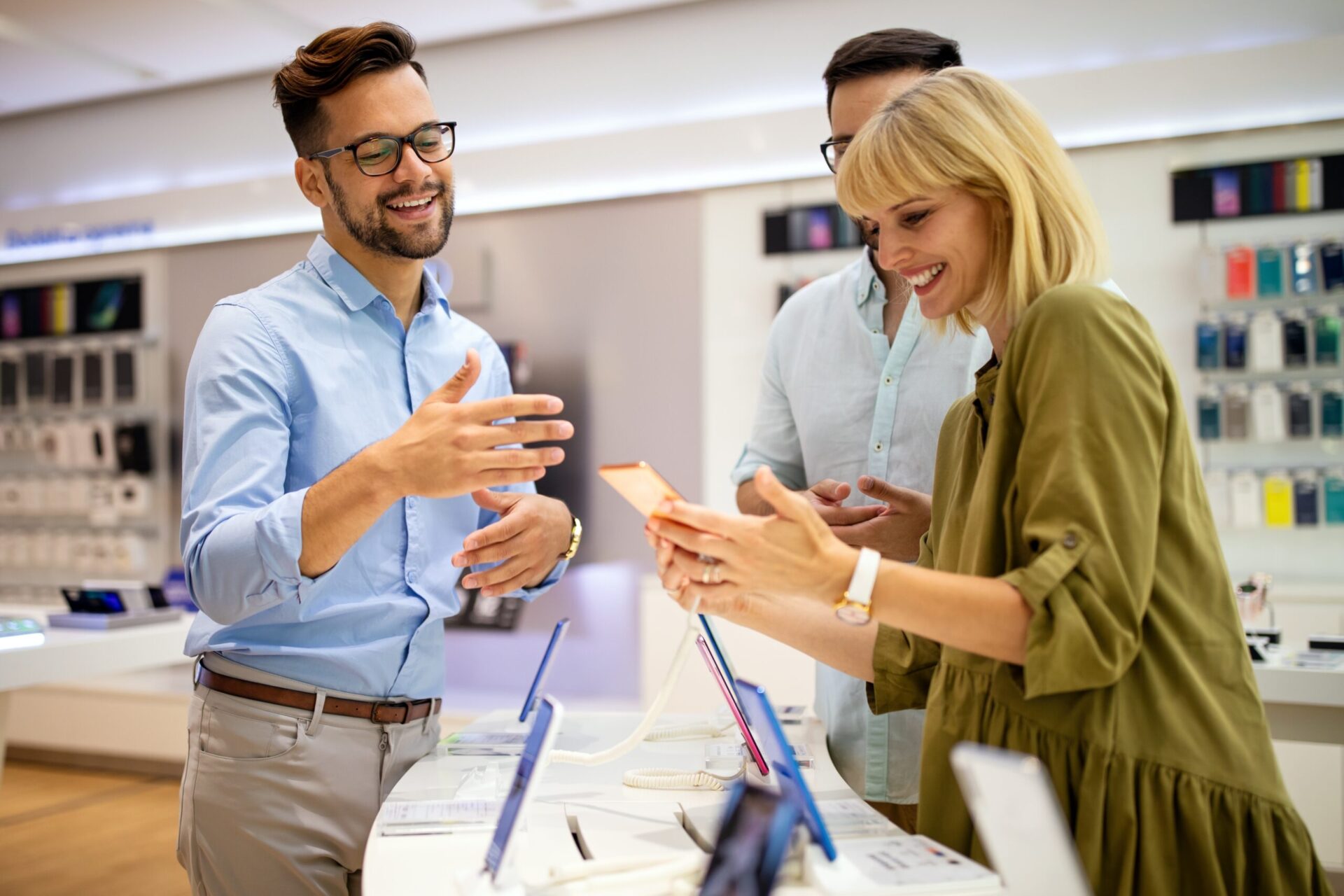 Phone salesman showing customers a product